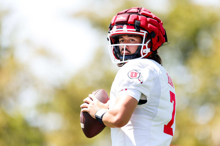 Utah Utes quarterback Cameron Rising looks to pass during a Utes practice.